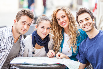 Group of Tourists Looking at Map