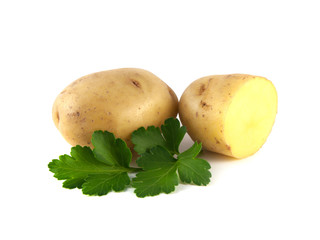 Potato with sliced half and green parsley isolated