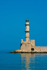 Fototapeta na wymiar Famous lighthouse in bay in Chania, Greece