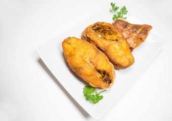 Portions of deep fried red snapper fish.