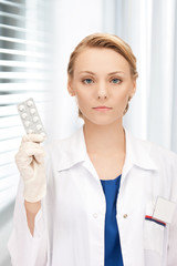 attractive female doctor with pills