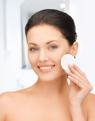 beautiful woman with cotton pad © Syda Productions