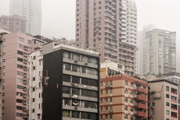 Fotobehang densely packed tower blocks in Hong Kong © Patrik Stedrak