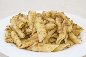 Italian penne pasta with chopped meat