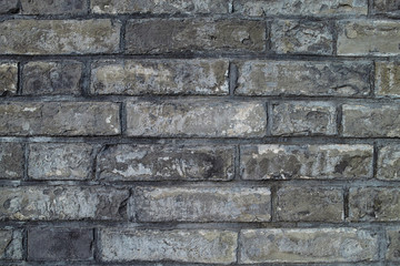 The grey brick wall
