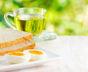 Boiled eggs, toasts and cup of tea.
