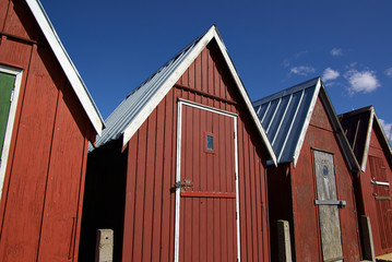 Beautiful red fishing huts on the coast