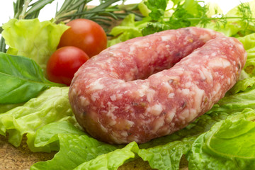 Salami with rosemary, salad and tomatoes