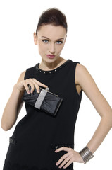 young beautiful adult girl wearing elegant dress holding purse