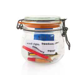 Pencils and books in glass jar