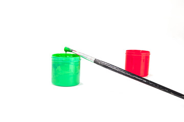 red and green paint boxes with brushes