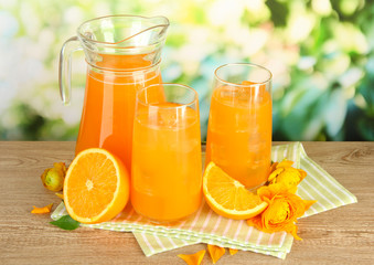 Naklejka na ściany i meble Glasses and pitcher of orange juice