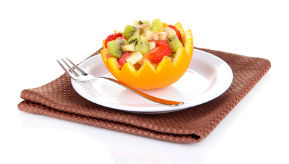 Fruit salad in hollowed-out orange isolated on white