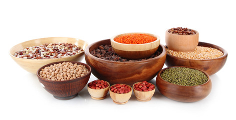 Different kinds of beans in bowls isolated on white