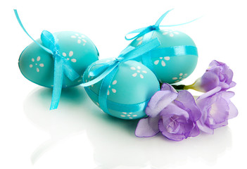 Bright easter eggs with bows and flowers, isolated on white