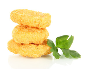 Fried chicken nuggets with parsley isolated on white