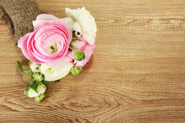 Ranunculus (persian buttercups) on wooden background
