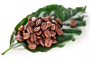 Coffee beans on leaf.