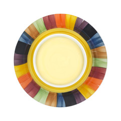 Obraz premium Cheddar cheese soup in colorful bowl