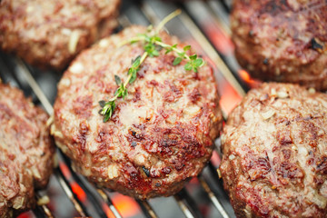 food meat - beef burgers on bbq  barbecue grill with flame