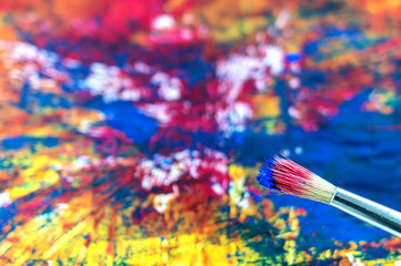 Fototapeta premium painting brush and detail of a painting