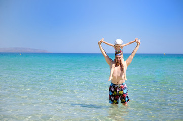Happy father and his daughter ready to swim