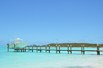 Fototapeta premium Yacht at the wooden jetty. Exuma, Bahamas
