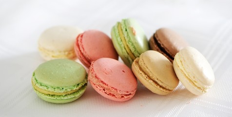 Colorful macaroons on white background