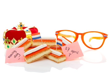 Typical Dutch tompouce sweet with crown and glasses