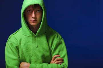 young man in green sweatshirt