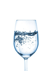 Water splash with bubbles in glass