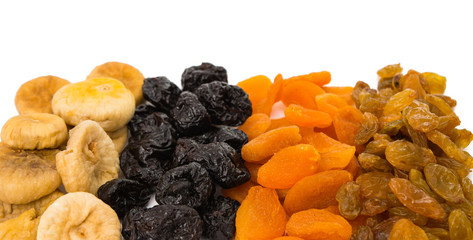 prunes, figs, dried apricots isolated on white background