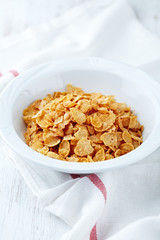 Corn flakes in a white bowl