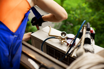 Air conditioning master preparing to install new air conditioner