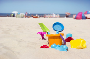 children's toys on beautiful beach sand