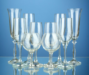 Collection of wine glasses, on blue background