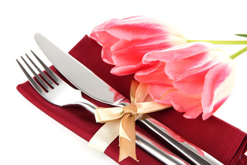 Festive dining table setting with tulips isolated on white