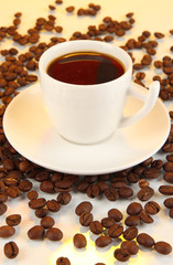 Cup of strong coffee on yellow background