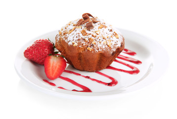 Tasty muffin cake with strawberries and chocolate