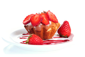 Tasty muffin cake with strawberries and chocolate