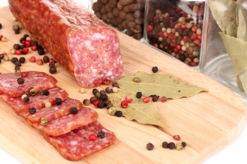 Tasty sausage on chopping board close-up