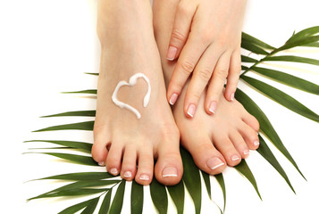 Beautiful woman legs with cream, isolated on white