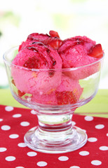 Delicious ice cream on table on bright background