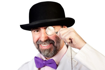 Happy looking man with a monocle in his hand
