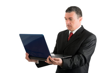 Older businessman with a laptop isolated on white background