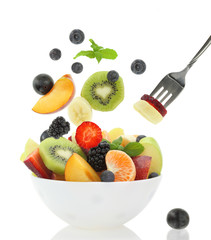 Fresh fruits coming out from a bowl