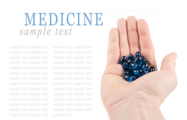 Pills on hand isolated on white