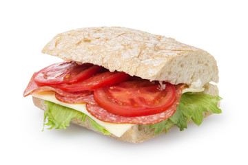 big sandwich with salami cheese tomato and salad leaves