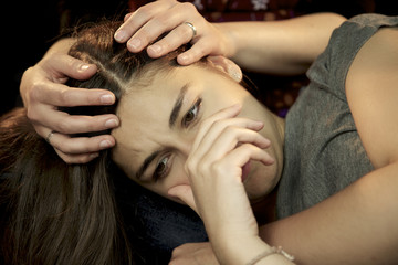 Obraz premium Woman holding sad depressed young woman