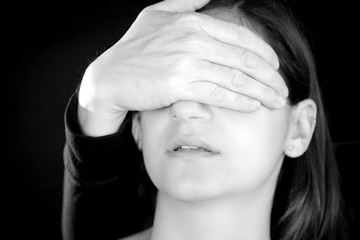 Woman scared with violent hand in front of face